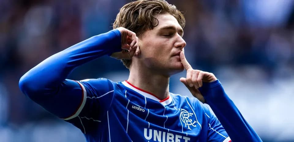 Player celebrating and signaling for silence after scoring