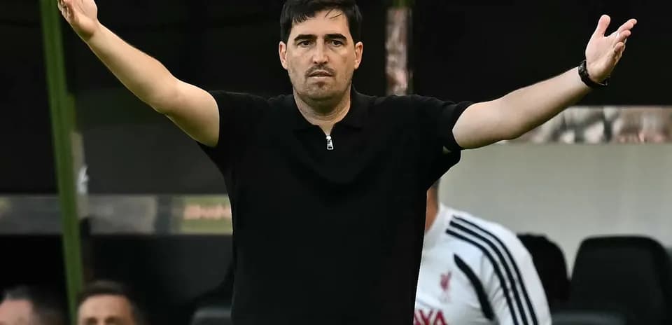 Coach gesturing during match from sidelines