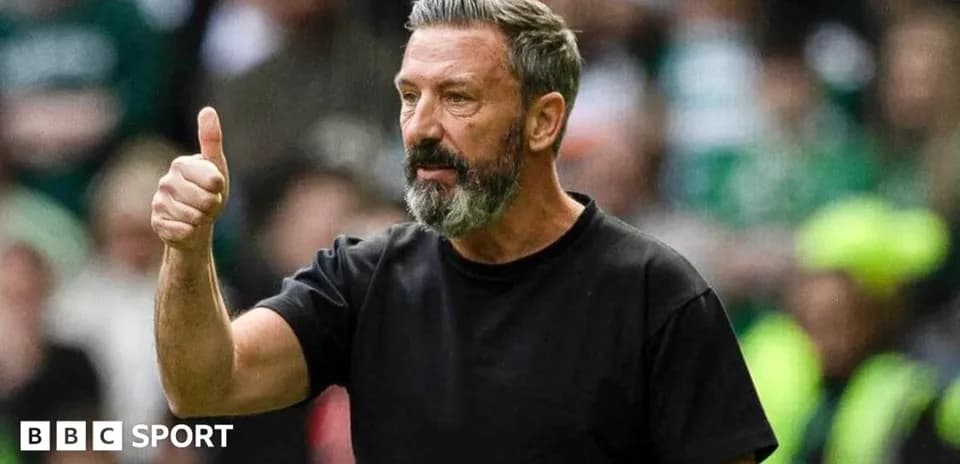 Coach giving a thumbs up during match