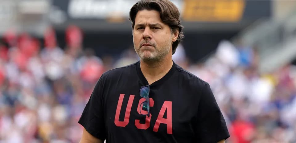 Coach wearing 'USA' shirt on the field