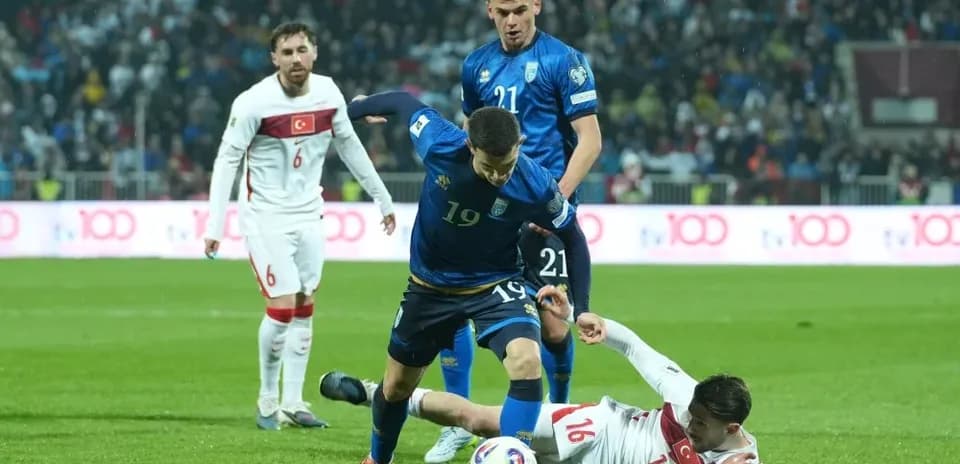 Player from blue team tackling opponent in red jersey