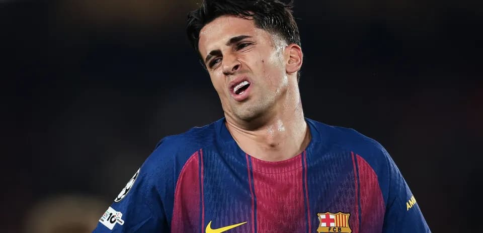 Player in FC Barcelona jersey showing frustration on field