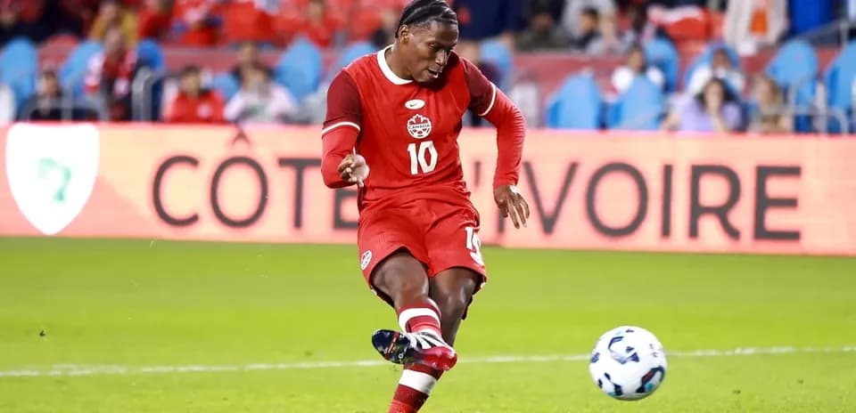 Player kicking ball during a soccer match