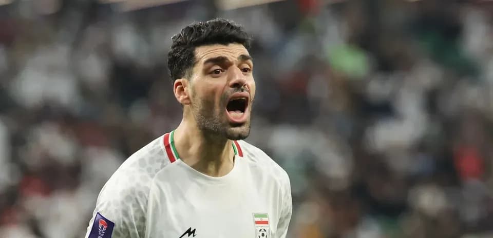 Player shouting during a football match celebration