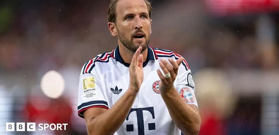 Player applauding fans while wearing Bayern Munich jersey