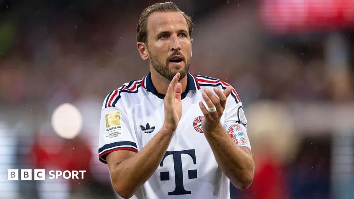Player applauding fans while wearing Bayern Munich jersey