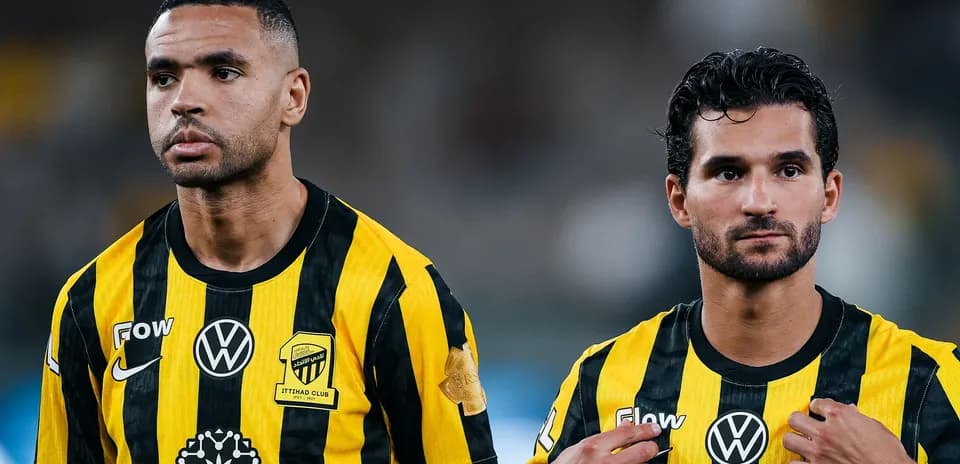 Two players in yellow and black striped jerseys