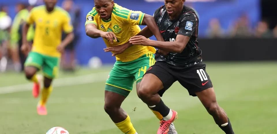 Players contesting for the ball during soccer match