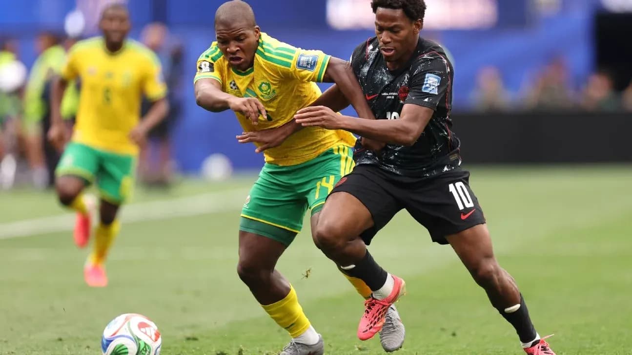 Players contesting for the ball during soccer match