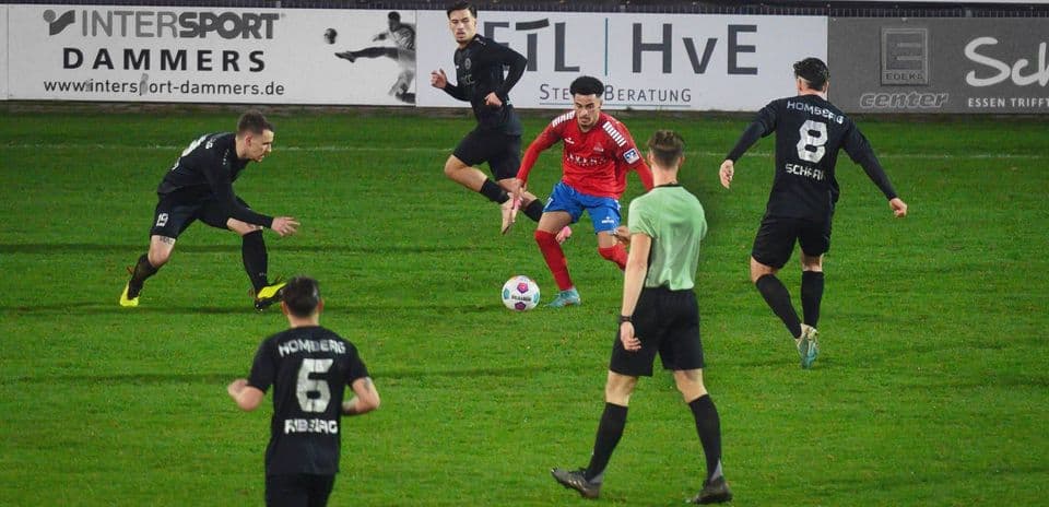 Players contesting for the ball in Oberliga match