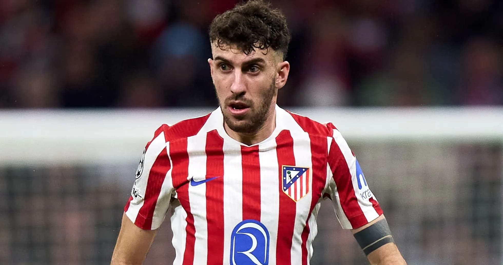 Atletico Madrid player in red and white jersey