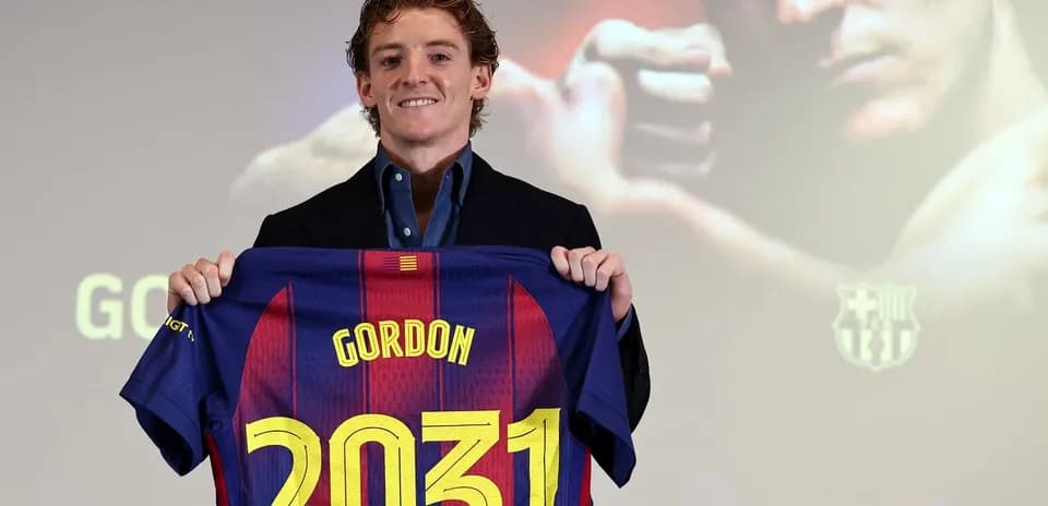 Player holding Barcelona jersey with name Gordon and number 2031