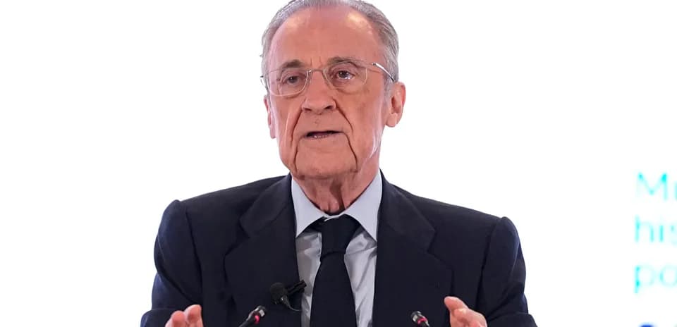 Executive speaking at a press conference podium