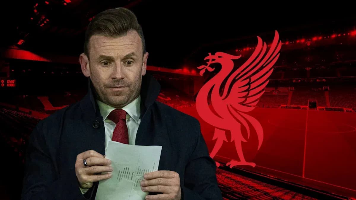 Presenter reading notes at Liverpool's stadium