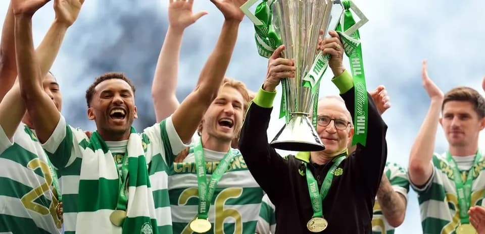 Celtic players celebrating with the championship trophy