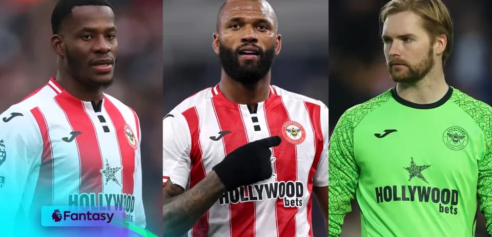 Three Brentford players in team jerseys during match
