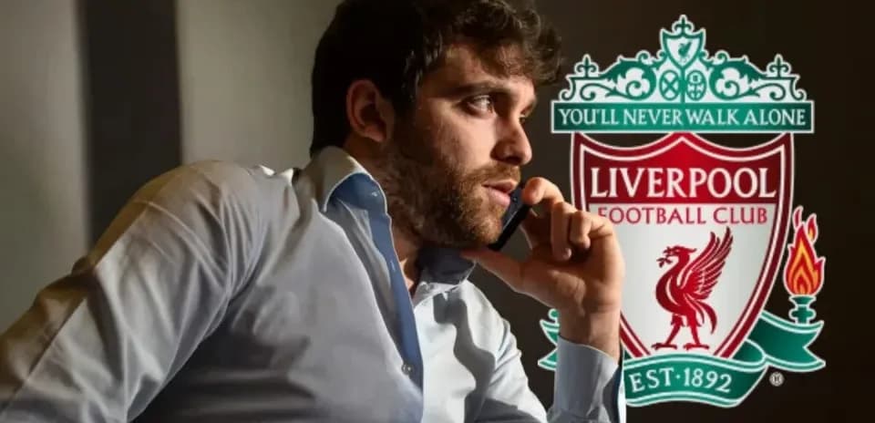 Person talking on the phone with Liverpool FC logo