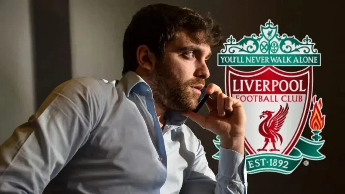 Person talking on the phone with Liverpool FC logo