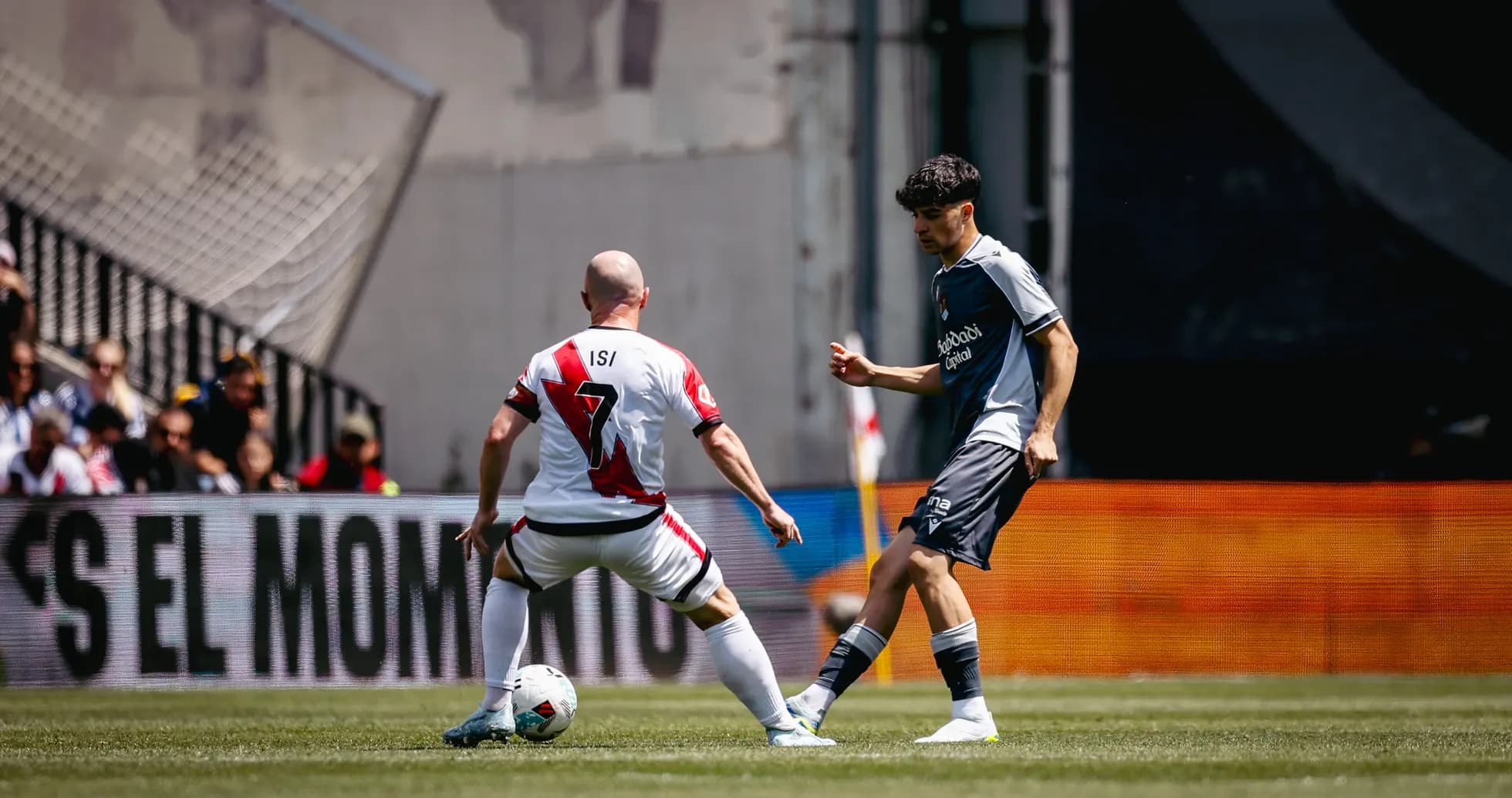Isi controlling the ball against Real Sociedad player