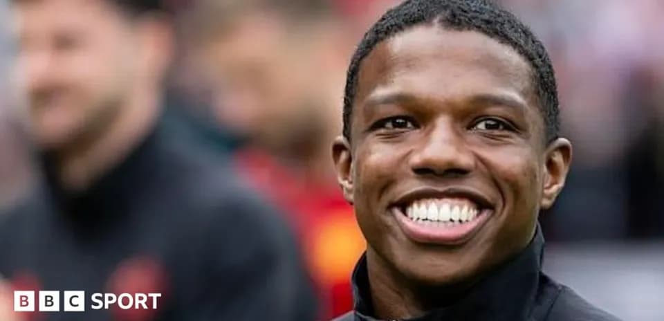 Player smiling before the match on the field