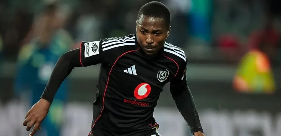 Player in black jersey running on the field