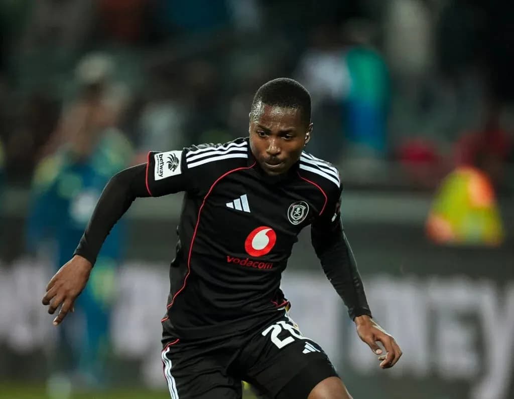 Player in black jersey running on the field