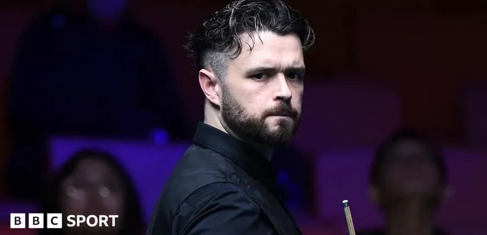 Snooker player preparing to take a shot
