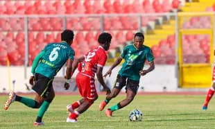 Players competing for the ball during a football match