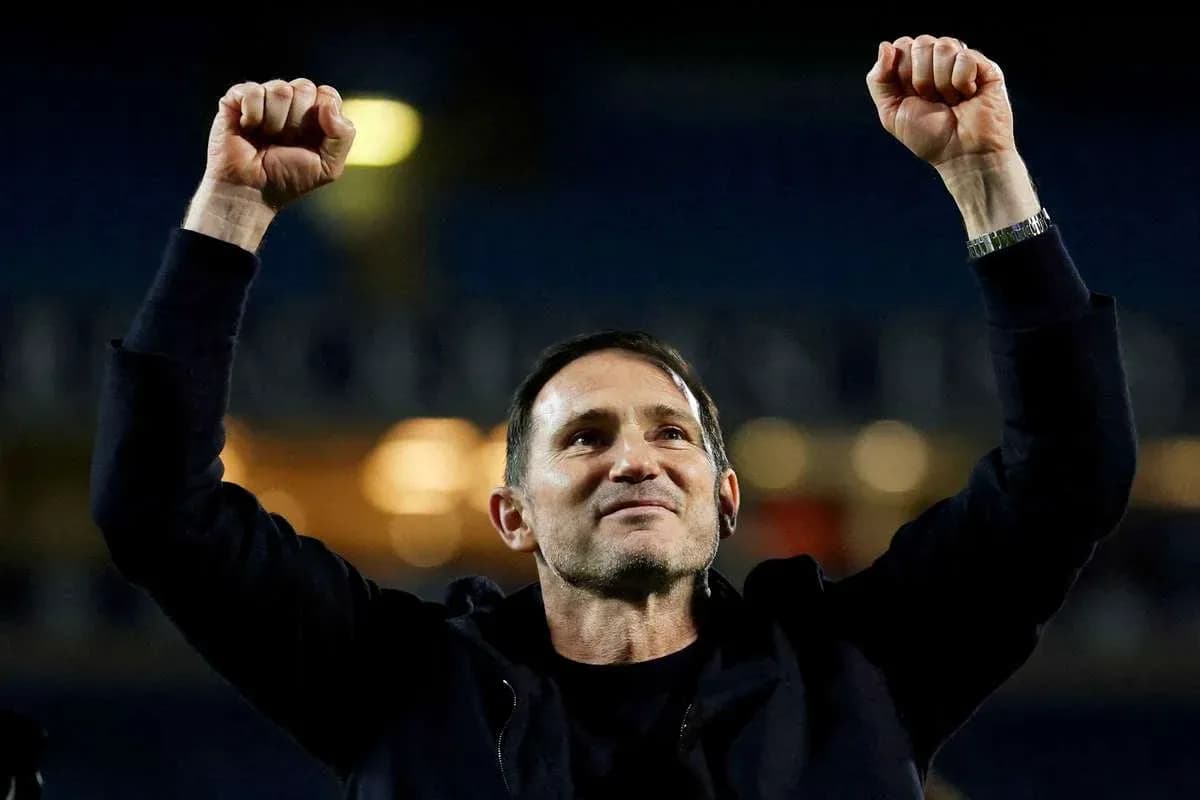 Coach celebrating with raised arms after victory