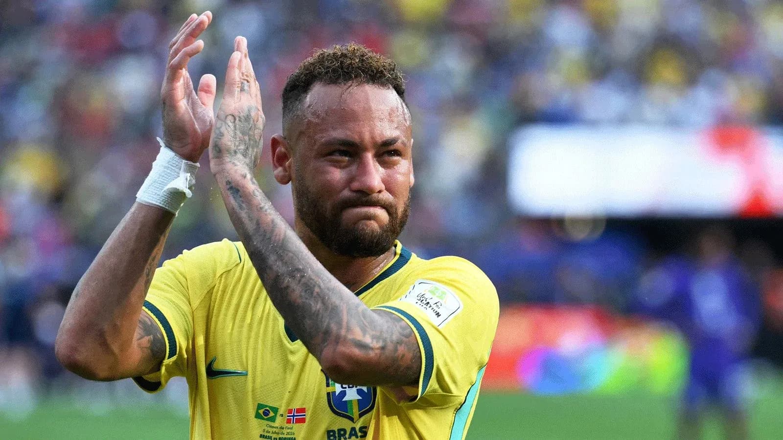 Player in Brazil jersey applauding the crowd