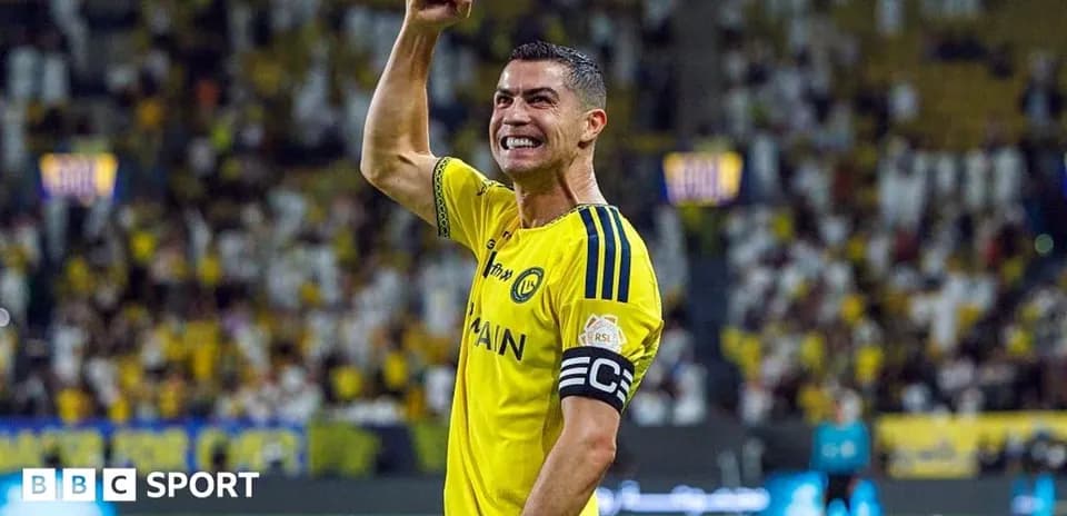 Player celebrating in yellow jersey with raised fist
