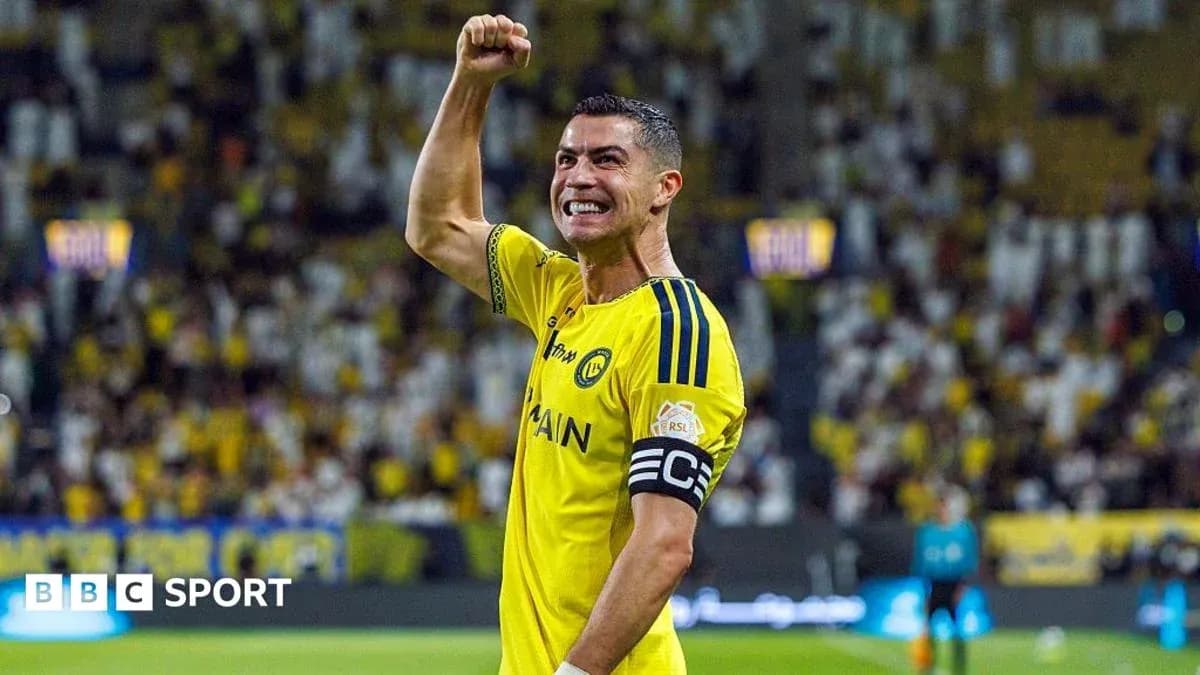 Player celebrating in yellow jersey with raised fist