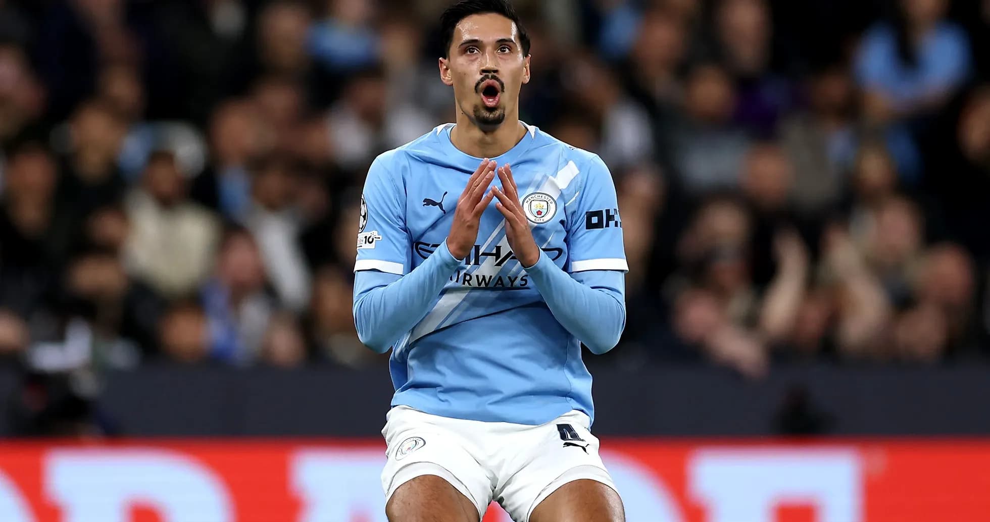 Player in blue jersey reacting on the pitch