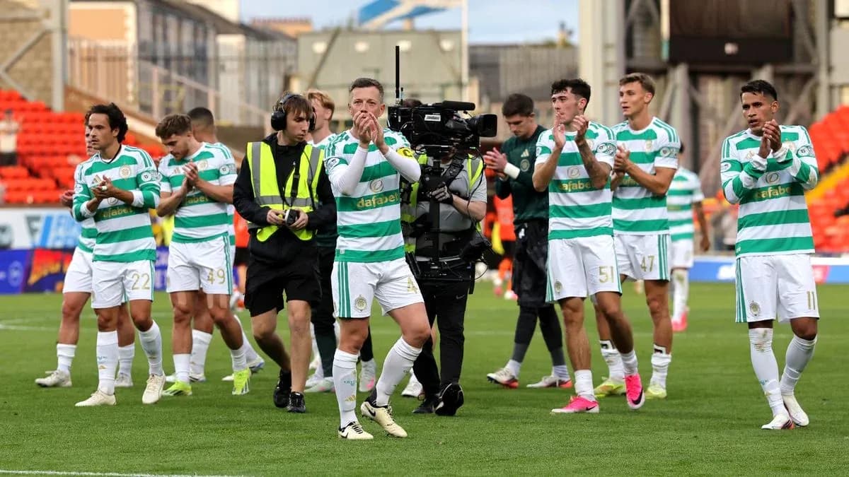 Celtic players applauding fans after match