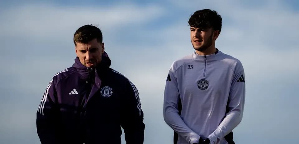 Two Manchester United players walking during training