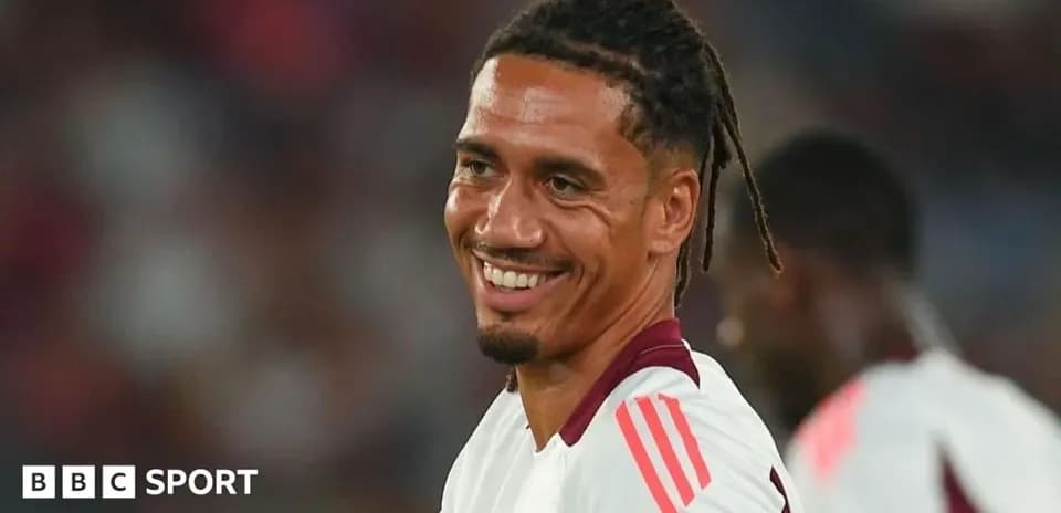 Football player smiling during warm-up session