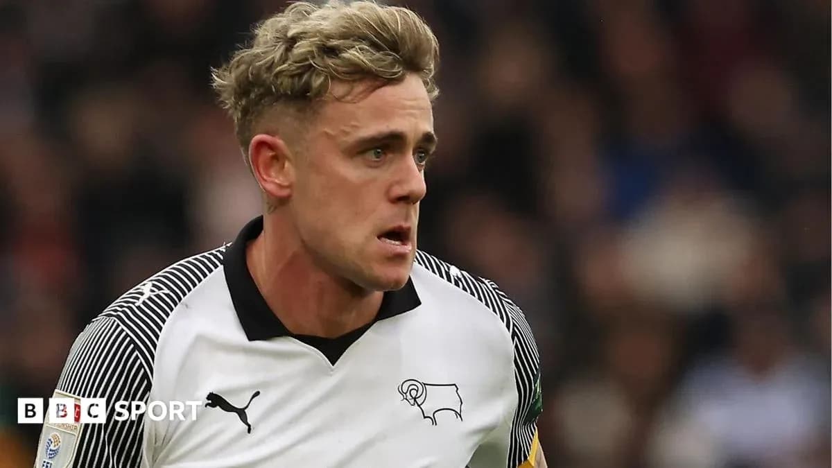 Player in Derby County kit running during match