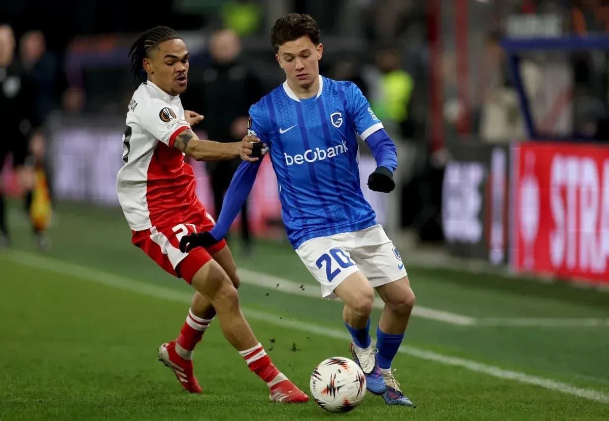Two players contesting for the ball during match