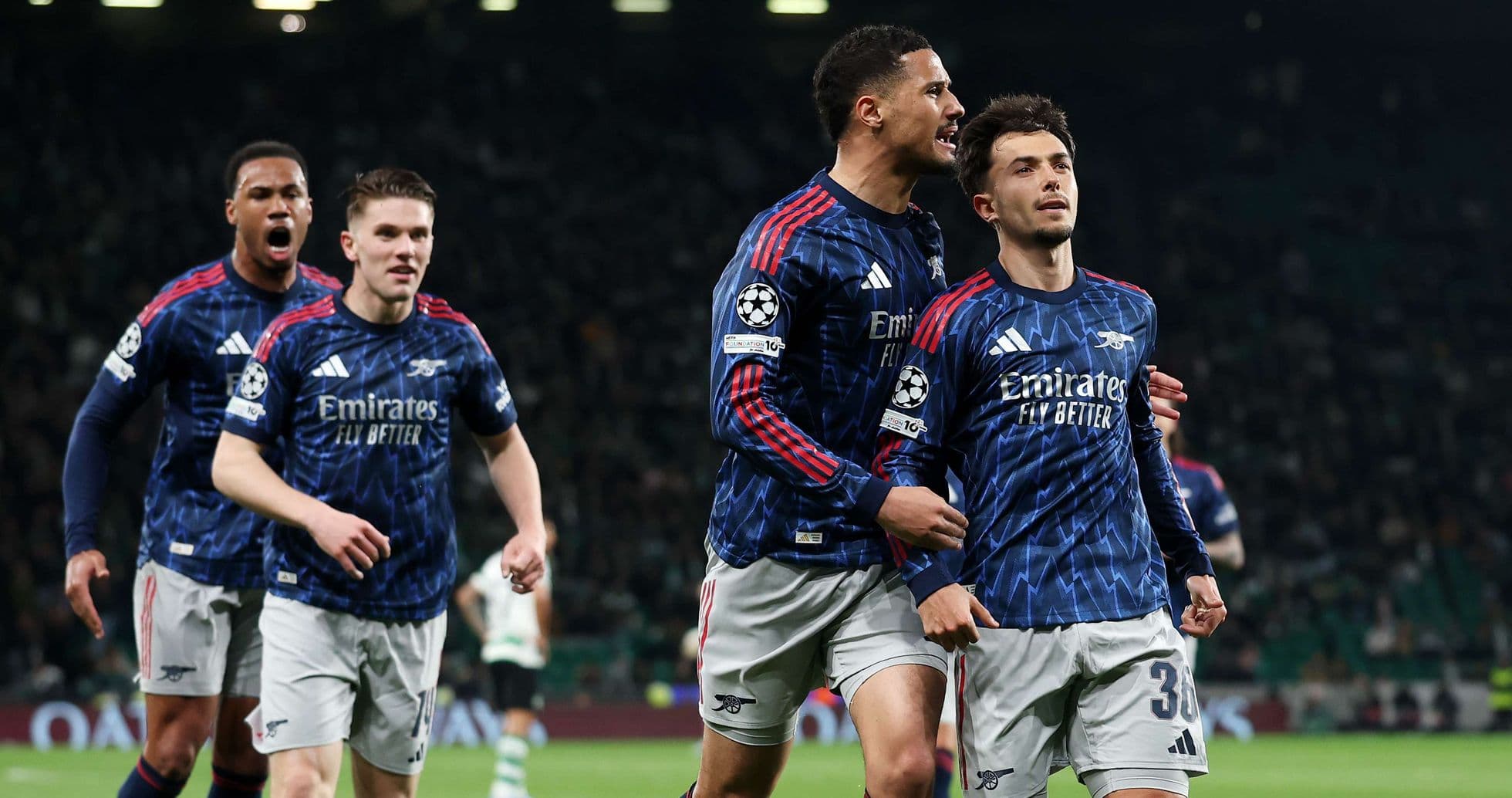 Arsenal players celebrating a goal in Champions League
