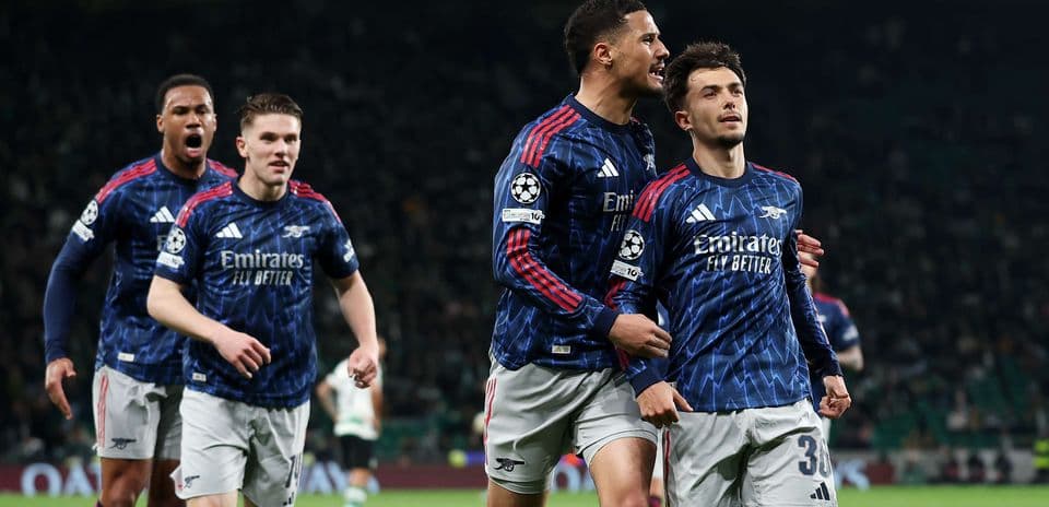 Arsenal players celebrating a goal in Champions League