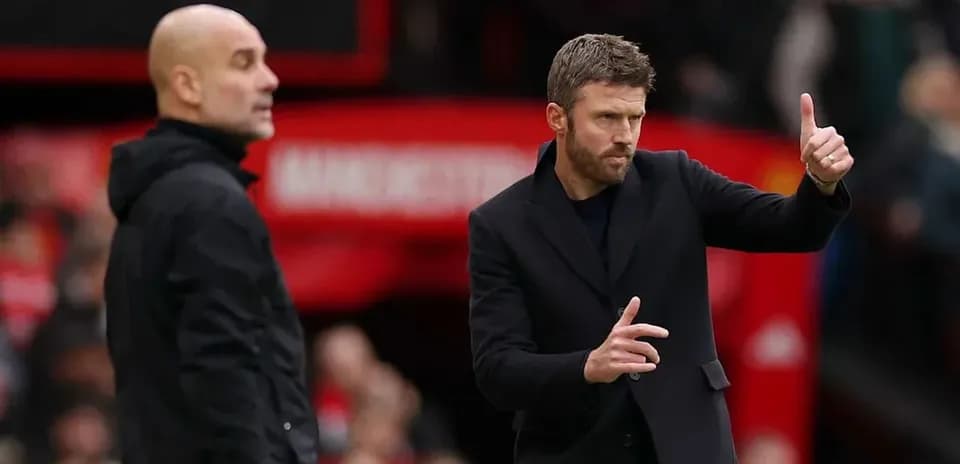Two football managers on the sidelines during match