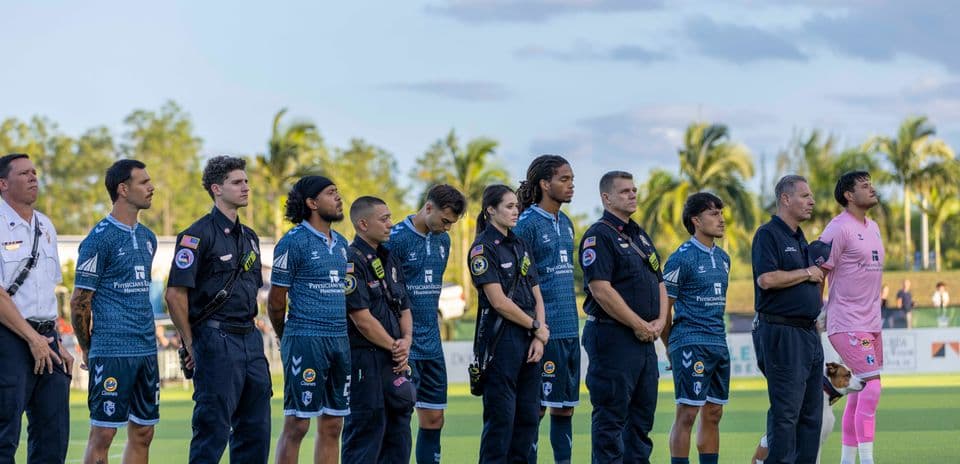 Players and officials during pre-match ceremony