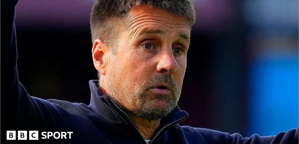 Manager gesturing during match on the sidelines