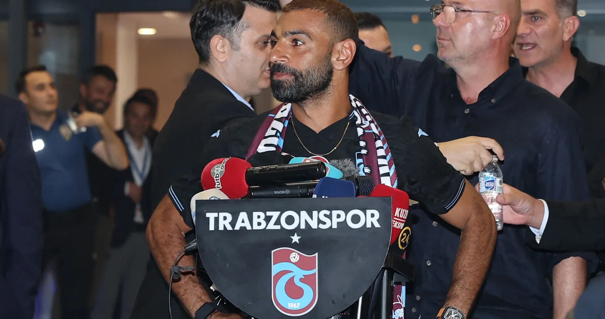 Player at press conference with Trabzonspor logo