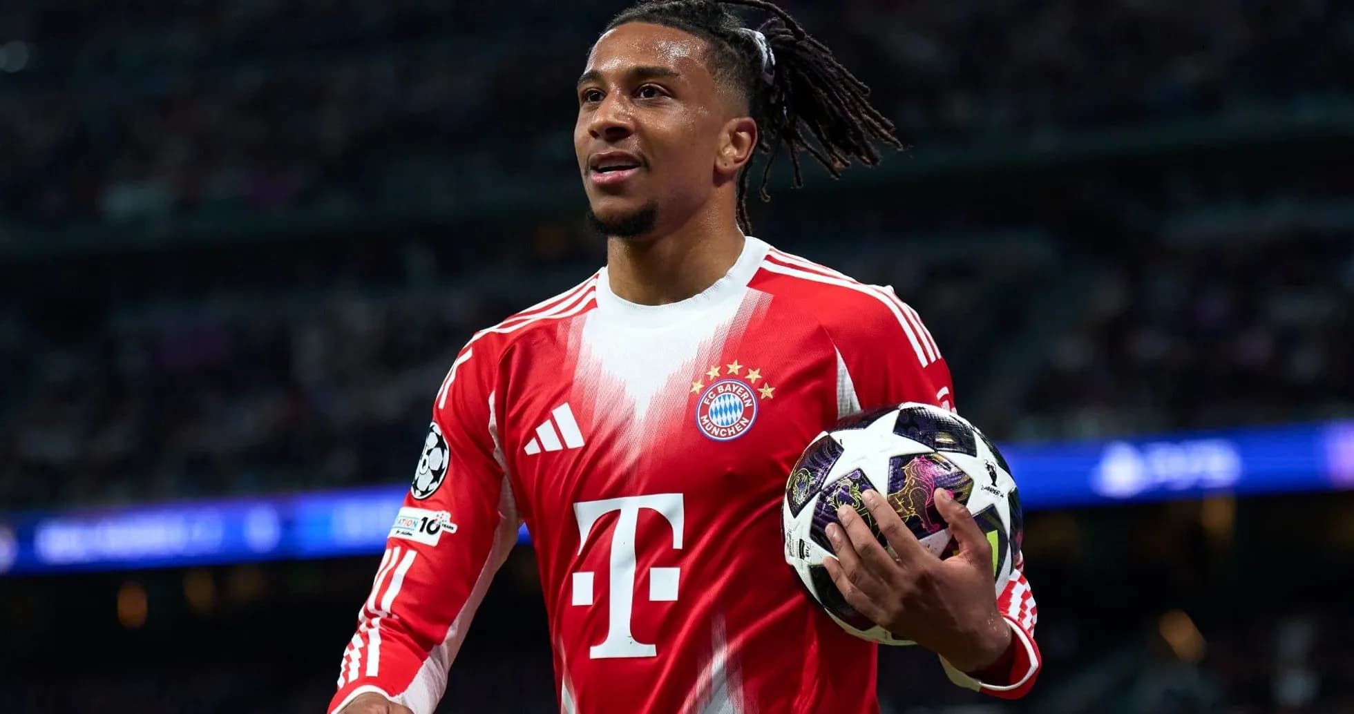 Player holding soccer ball during match for Bayern Munich