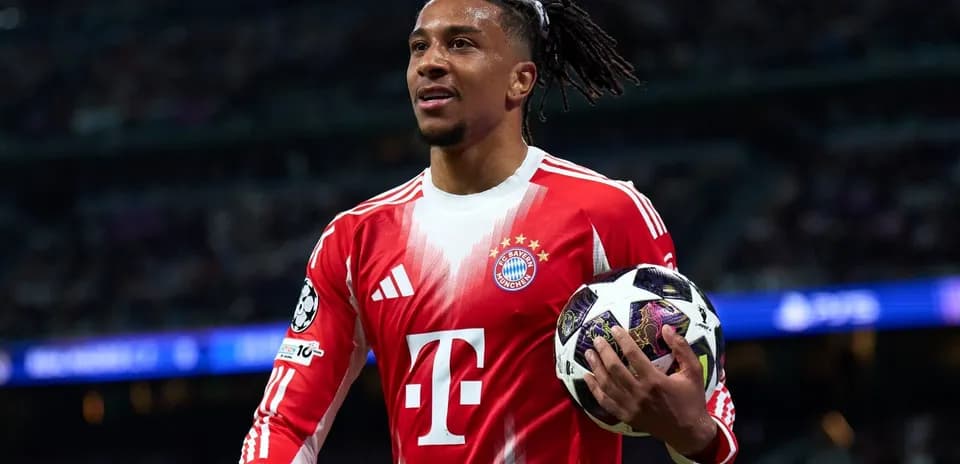Player holding soccer ball during match for Bayern Munich