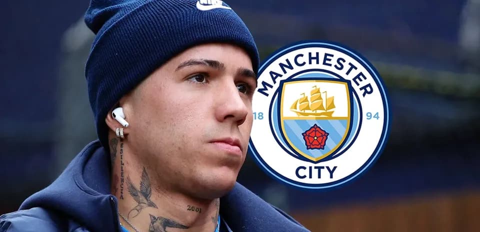 Player wearing headphones with Manchester City logo