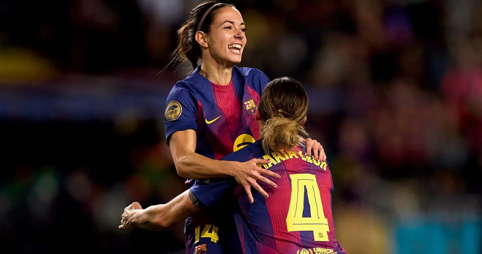 Barcelona players celebrating a goal on the field