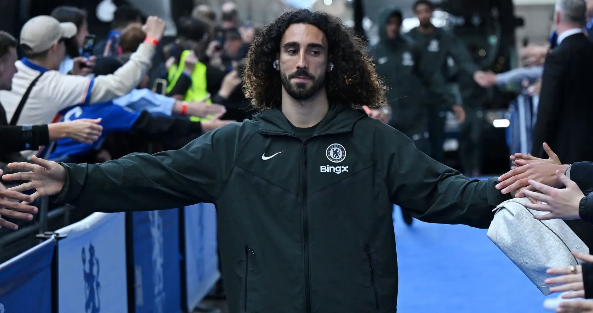 Player interacting with fans before the match