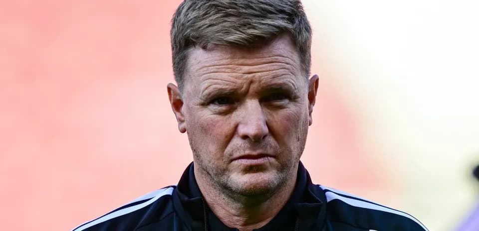 Coach in black tracksuit during pre-match preparations